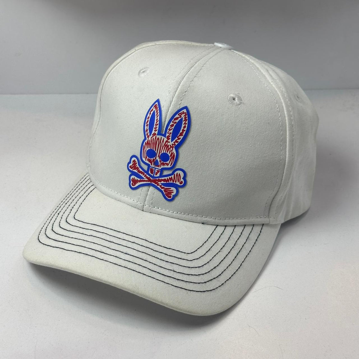 GORRA PSYCHO BUNNY BLANCA